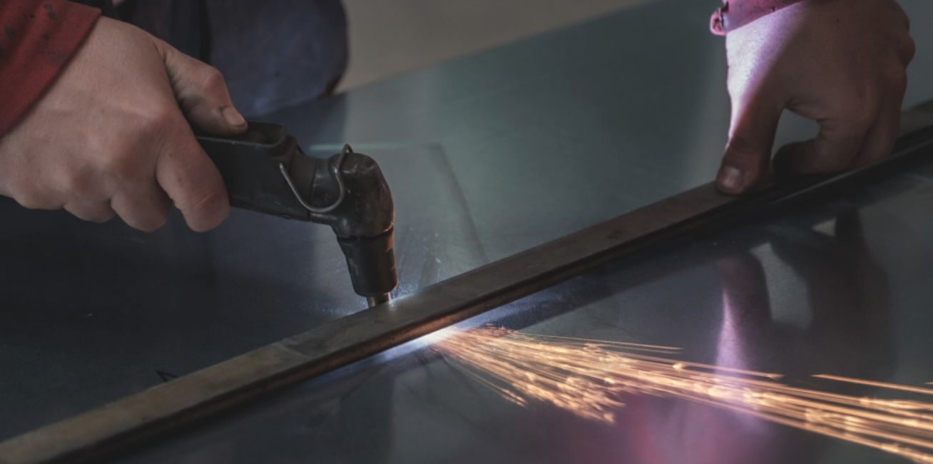 Welder in the process of manufacturing a generator