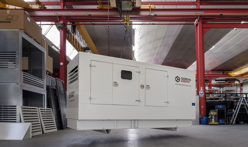 Industrial generator being installed at a plant.