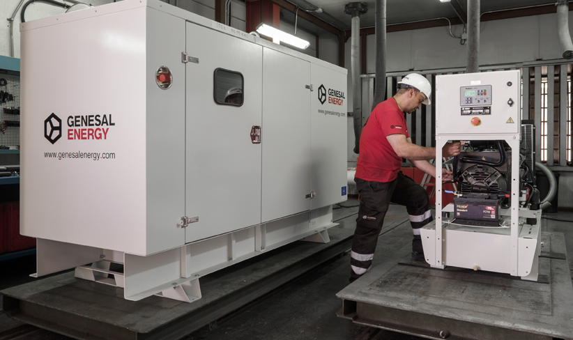 Technician working on the installation of a new industrial generator.