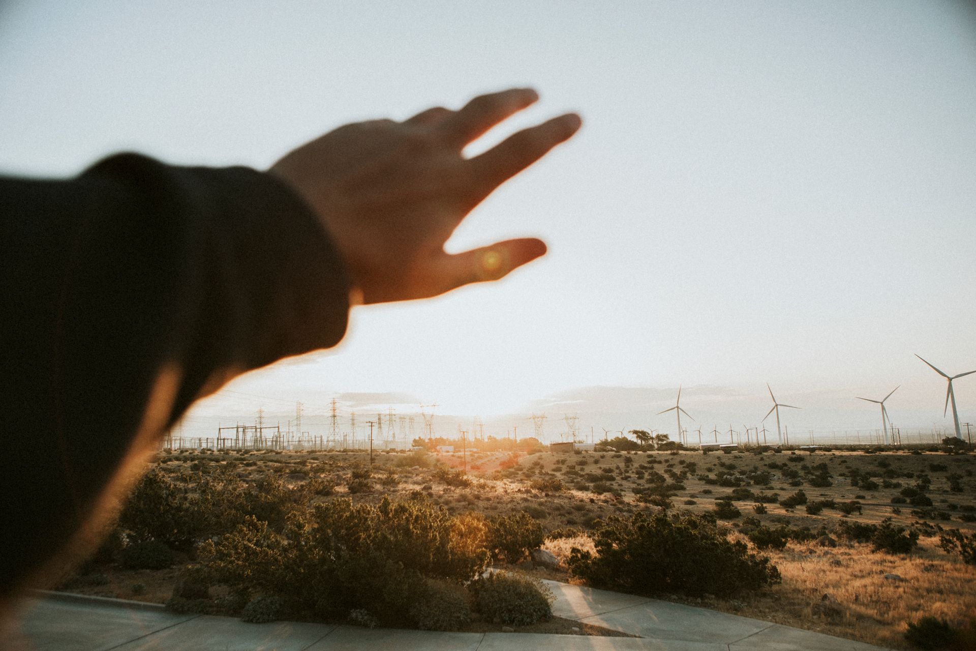 Landscape with wind turbines at sunset, symbolizing the transition to renewable energy with energy safety and the fight against climate change.