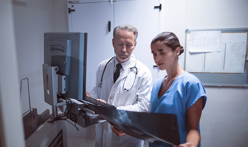 Doctors in a hospital reviewing an X-ray