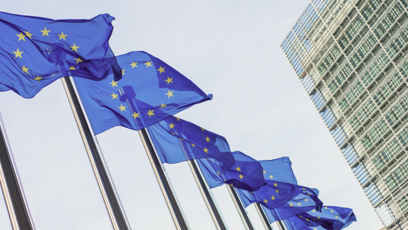 European Union flags waving in Brussels.